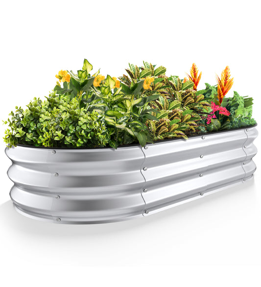 Silver 4x2x1 ft galvanized steel raised garden bed with mixed plants and flowers, oval metal planter for outdoor vegetable gardening
